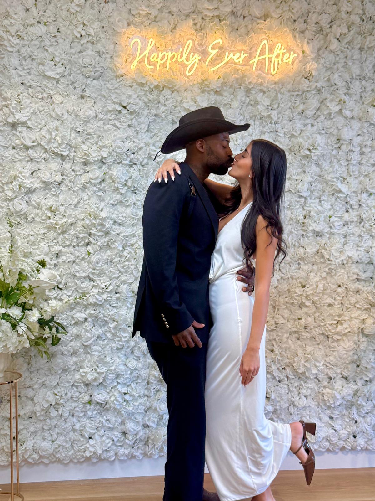 Couple getting married in New York with simple wedding ceremony and bouquet near city